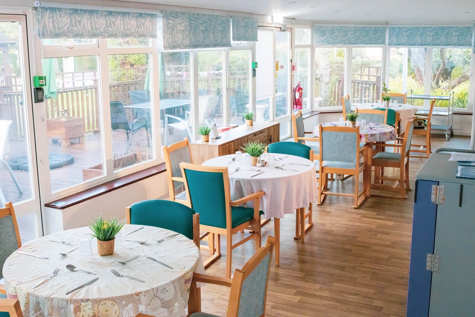 The conservatory dining room laid up for lunch