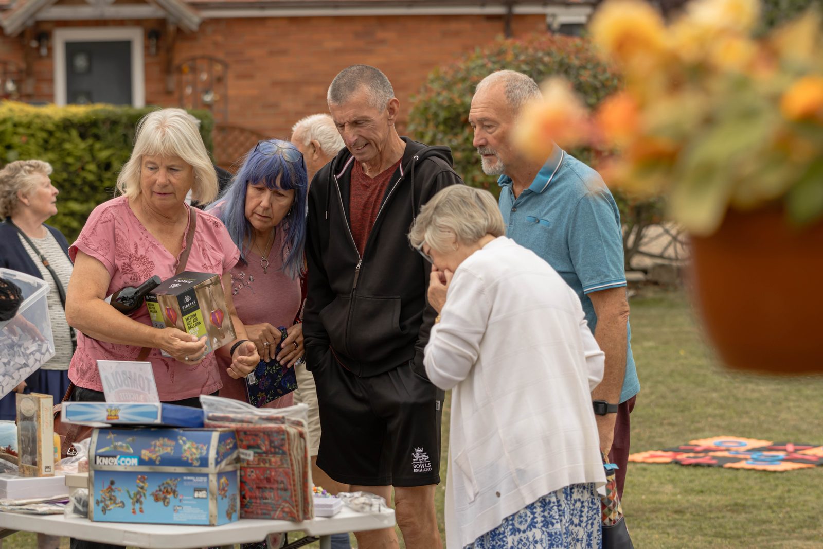 Visitors choosing prizes on the tombola stall